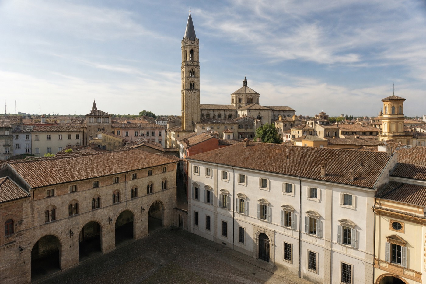 Parma Cathedral's Romanesque facade and bell tower seen across Piazza Duomo in the historic center of Parma, Italy