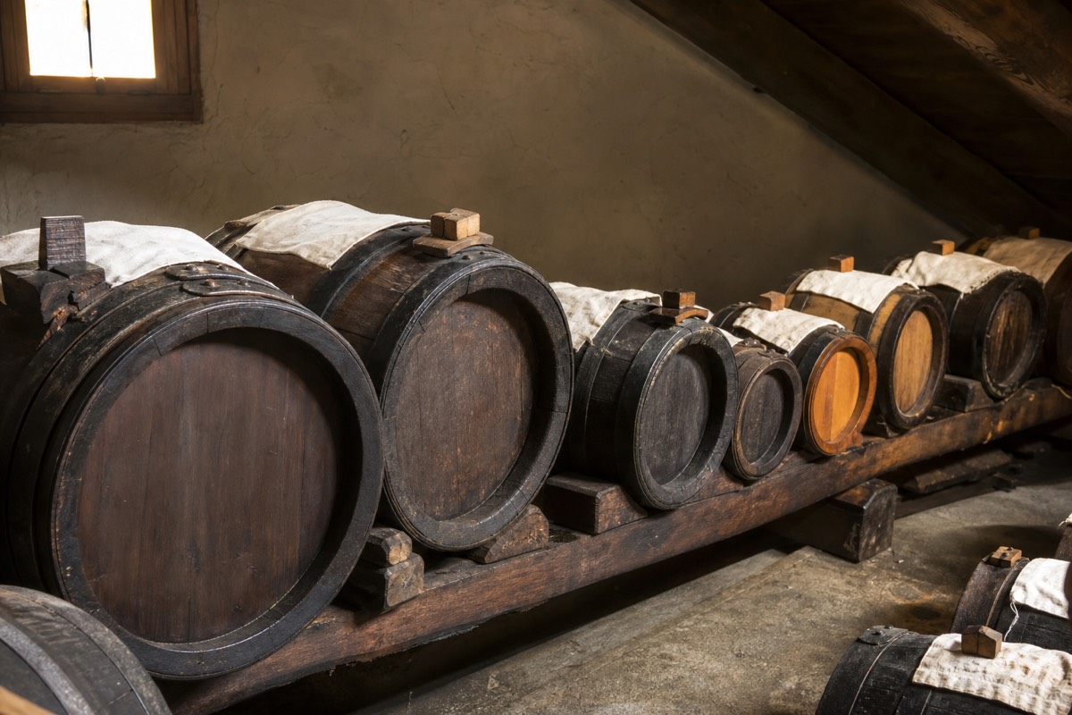 Traditional balsamic vinegar aging in wooden barrels